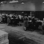 Employees working in the Nelson and Sons bindery.