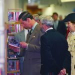 Prince Charles reading a Harlequin Mills & Boon title